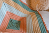 crochet baby blanket in nursery setting soft handmade blanket