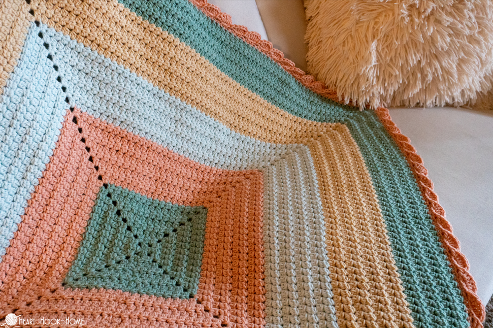crochet baby blanket in nursery setting soft handmade blanket