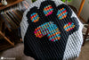 full view c2c crochet cat blanket on couch