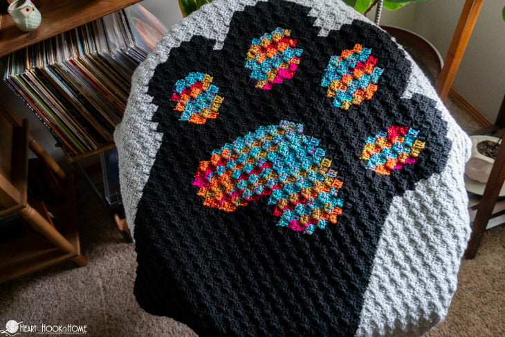 full view c2c crochet cat blanket on couch