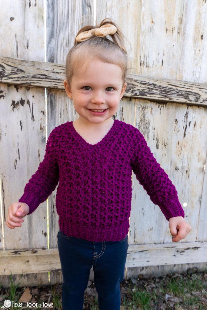child wearing crochet v neck sweater pullover