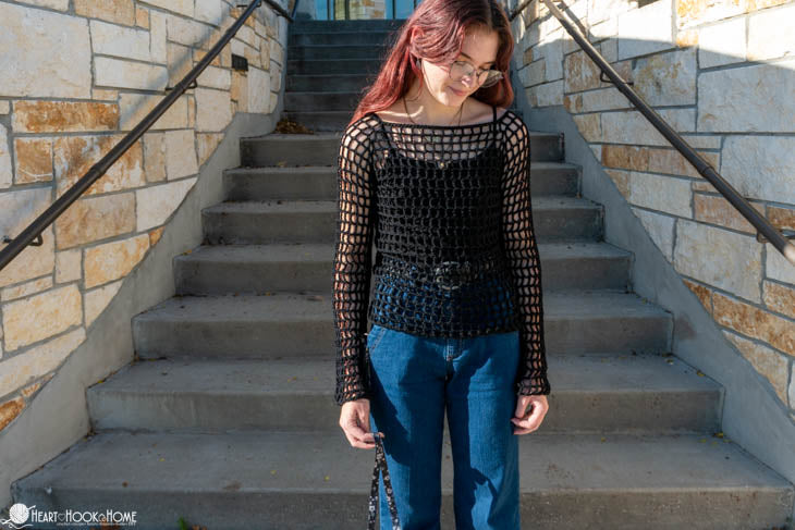 woman wearing crochet mesh sleeves blouse