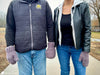 couple wearing shared crochet mitten holding hands