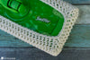 crochet swiffer cover fitted on mop cleaning tool