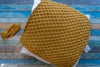 crochet diamond pillow cover styled on sofa