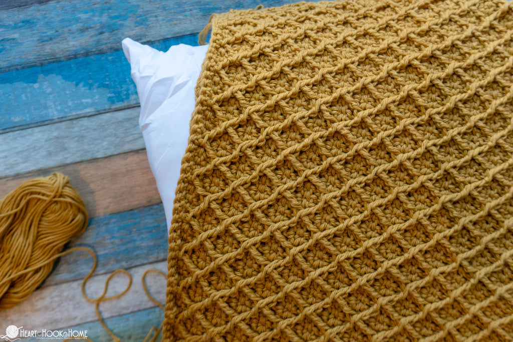 close up textured diamond crochet stitch pillow cover