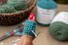 crochet finger cuff guiding yarn while crocheting