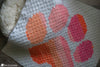 crochet paw print blanket used in dog kennel