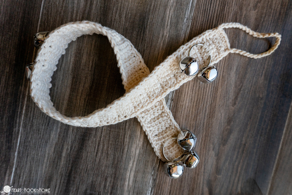 close up crochet dog bell strap with attached bells