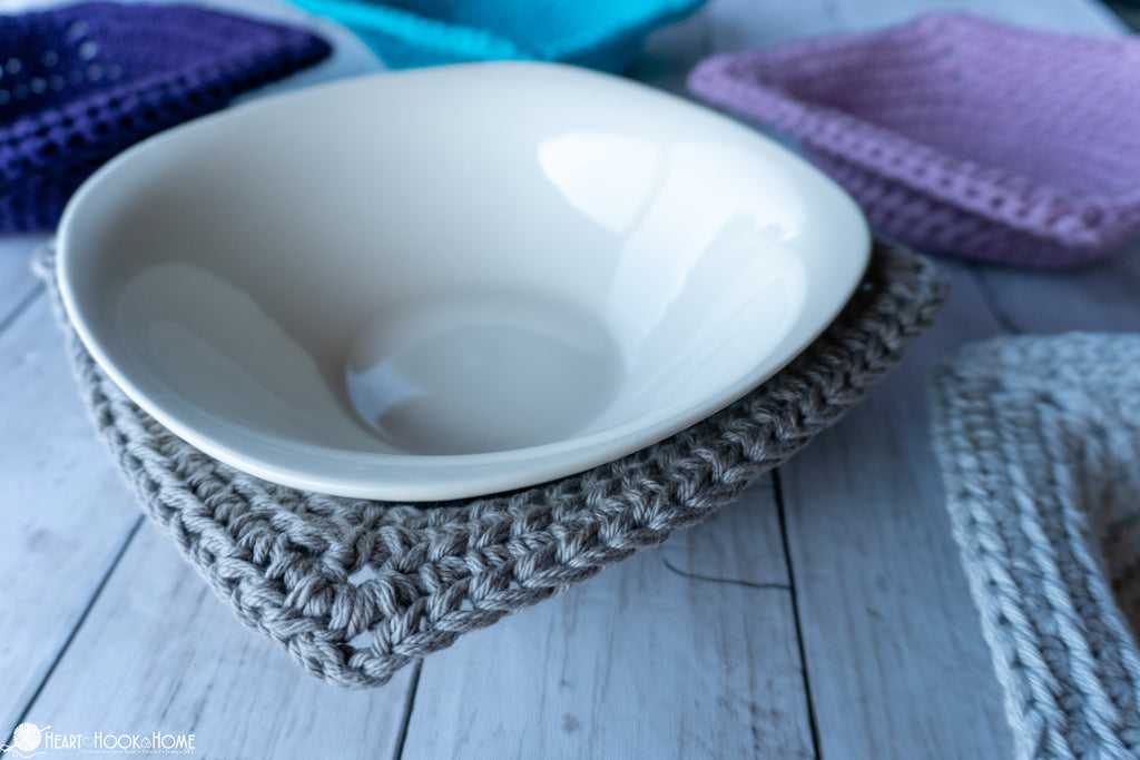 crochet bowl cozy holding hot bowl from microwave
