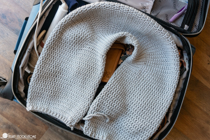 crochet travel pillow open showing storage space inside