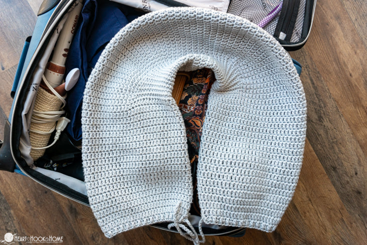crochet travel pillow in use for comfort during travel