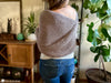 woman wearing crochet scarf with sleeves wrap