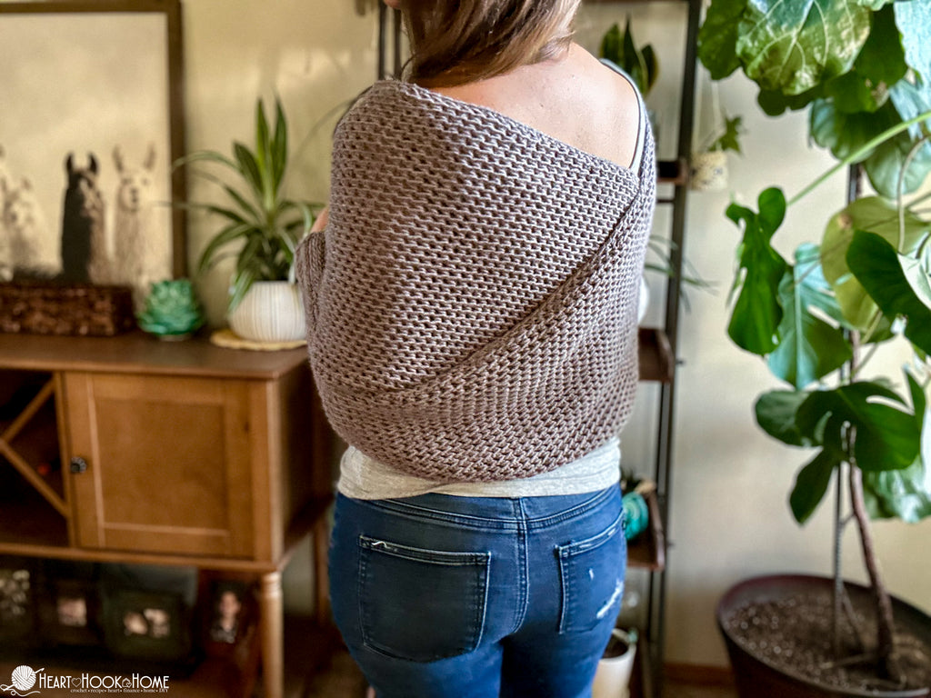 woman wearing crochet scarf with sleeves wrap