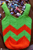 child holding crochet trick or treat bag halloween