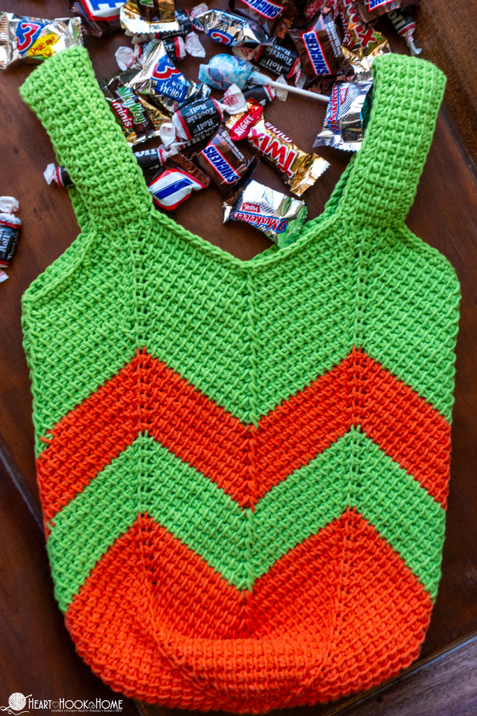 child holding crochet trick or treat bag halloween