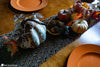 crochet fall table runner displayed on dining table